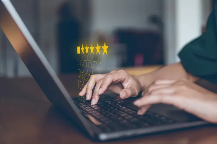 woman on laptop conducting customer research