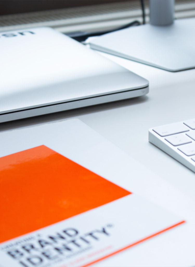 desk space with brand identity book at ronins digital agency in guildford surrey