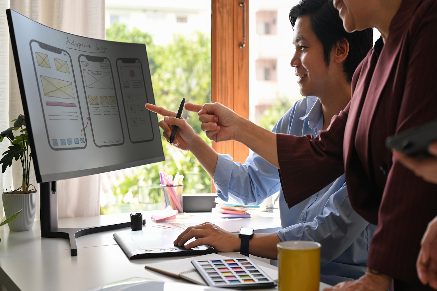 Team members of our London digital agency drawing up designs for a new client