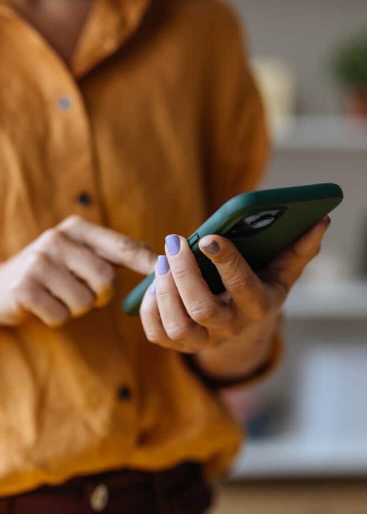 woman using mobile phone to gain seo insights